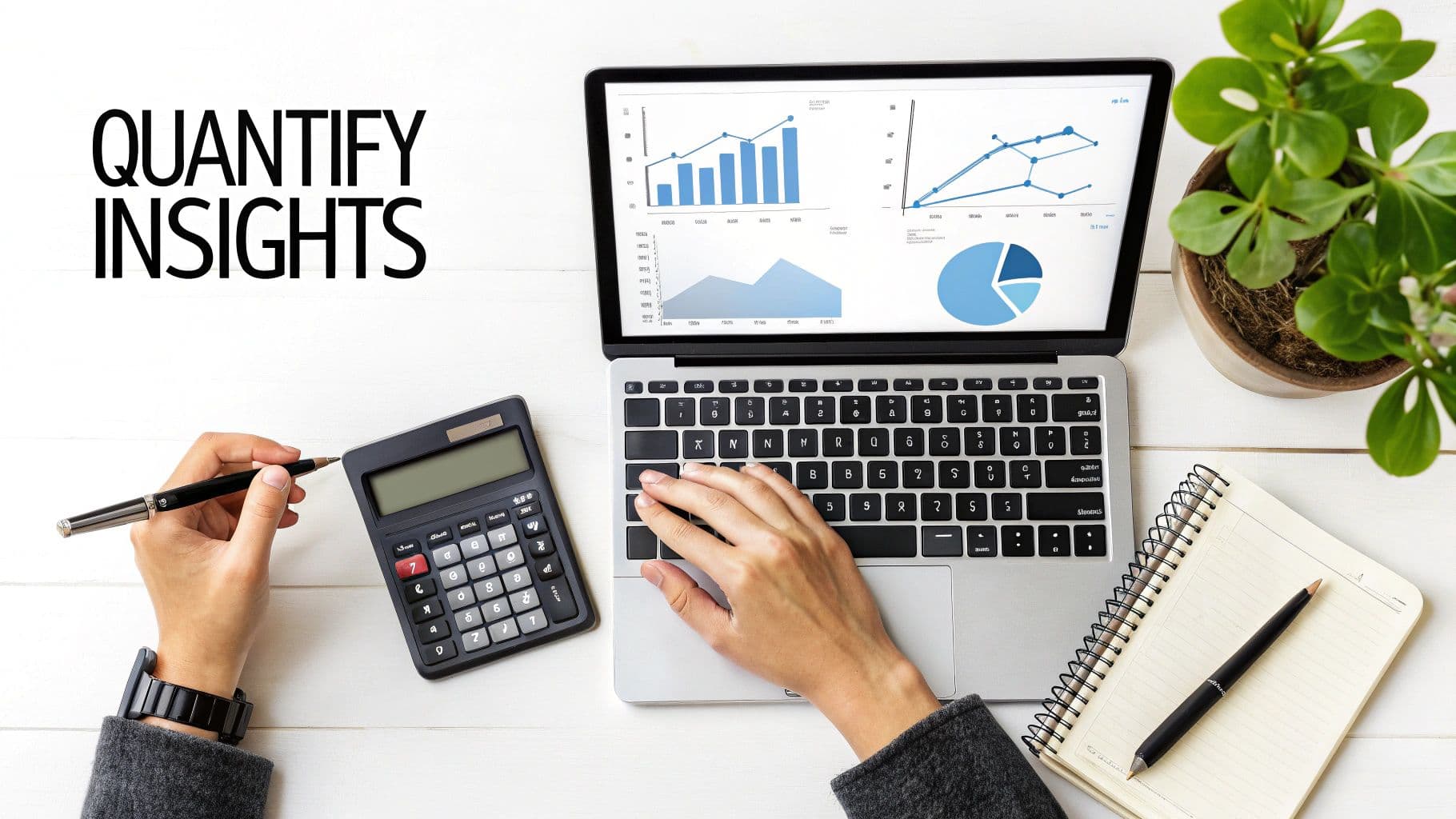 A person's hands are visible on a desk with a calculator and a laptop showing data analysis.