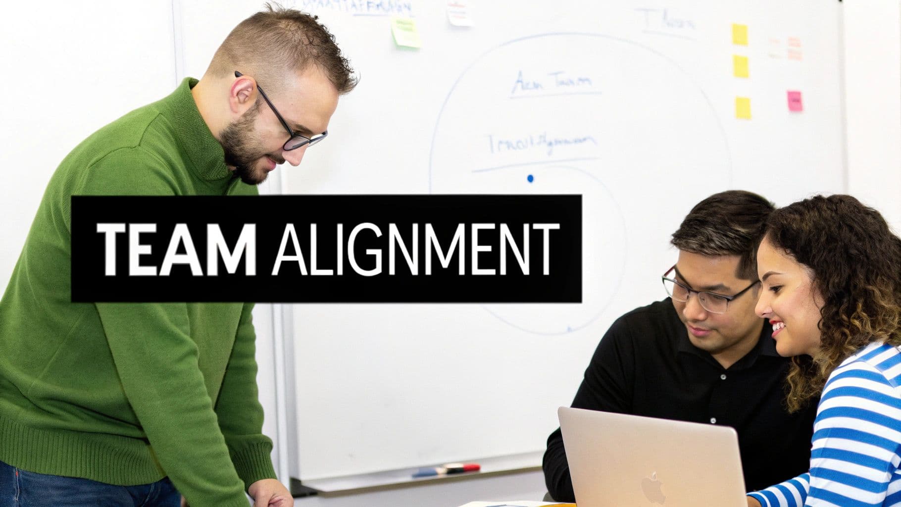 Three diverse colleagues collaborate in an office, discussing team alignment in a meeting.